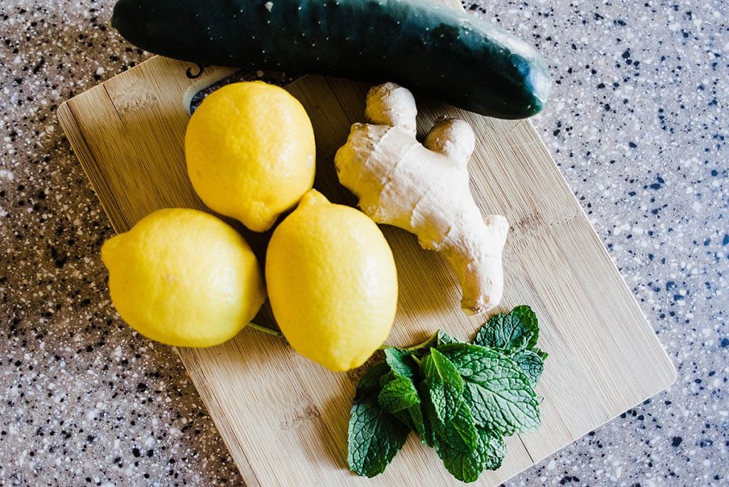 Photo of 4 simple ingredients that make up the secret to sassy water. Lemon, Ginger, Mint and Cucumber 
