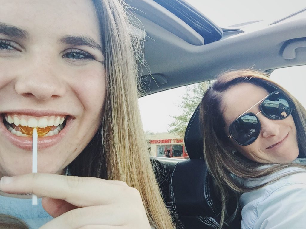 Image of Andie in the care goofing off with her oldest daughter Morgan! 