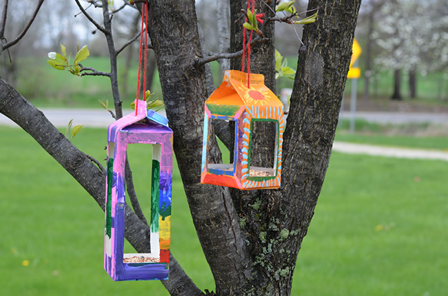 photo of upcycled bird houses made out of milk cartons 
