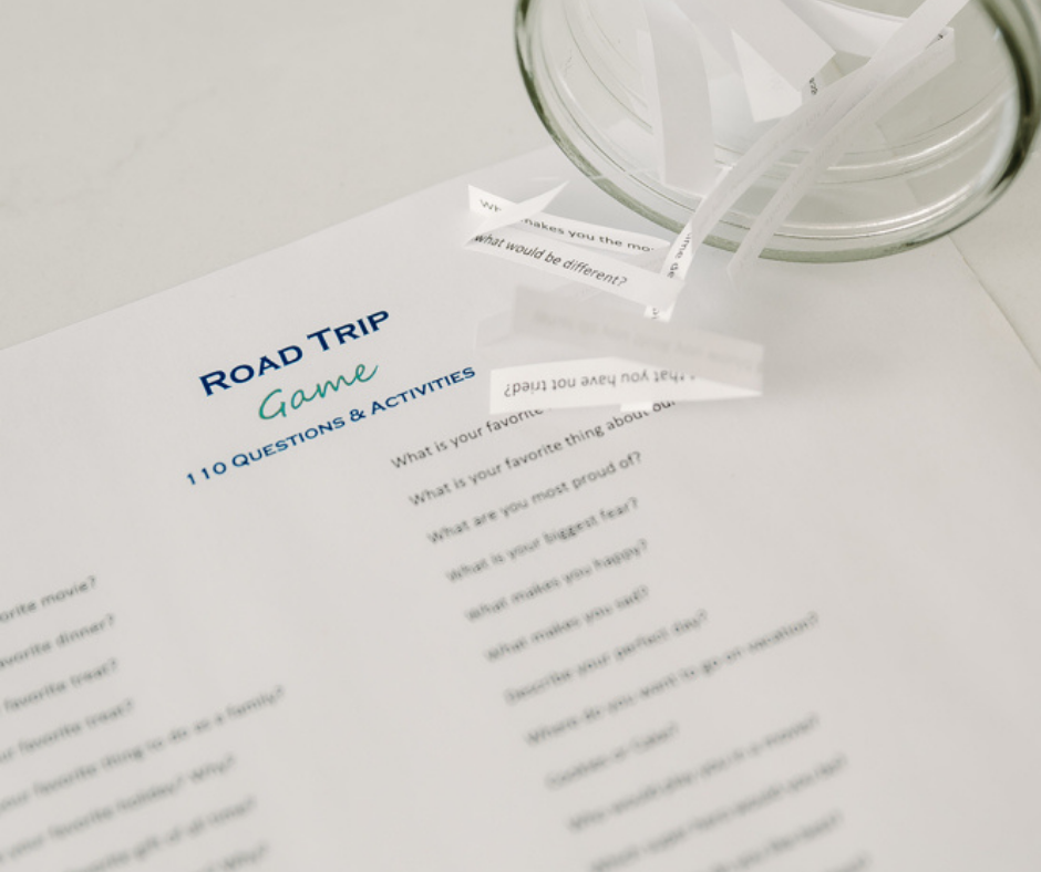 Photo of paper questions to print for the family road trip games - road trip jar.