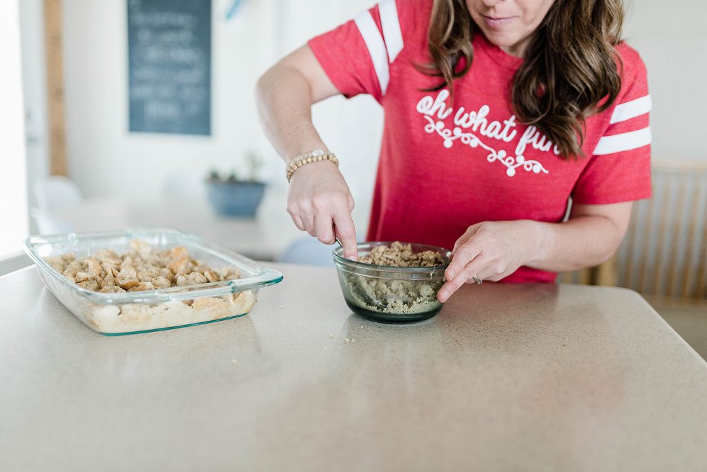 Andie is combing butter, brown sugar and pecans for the buttery crust.