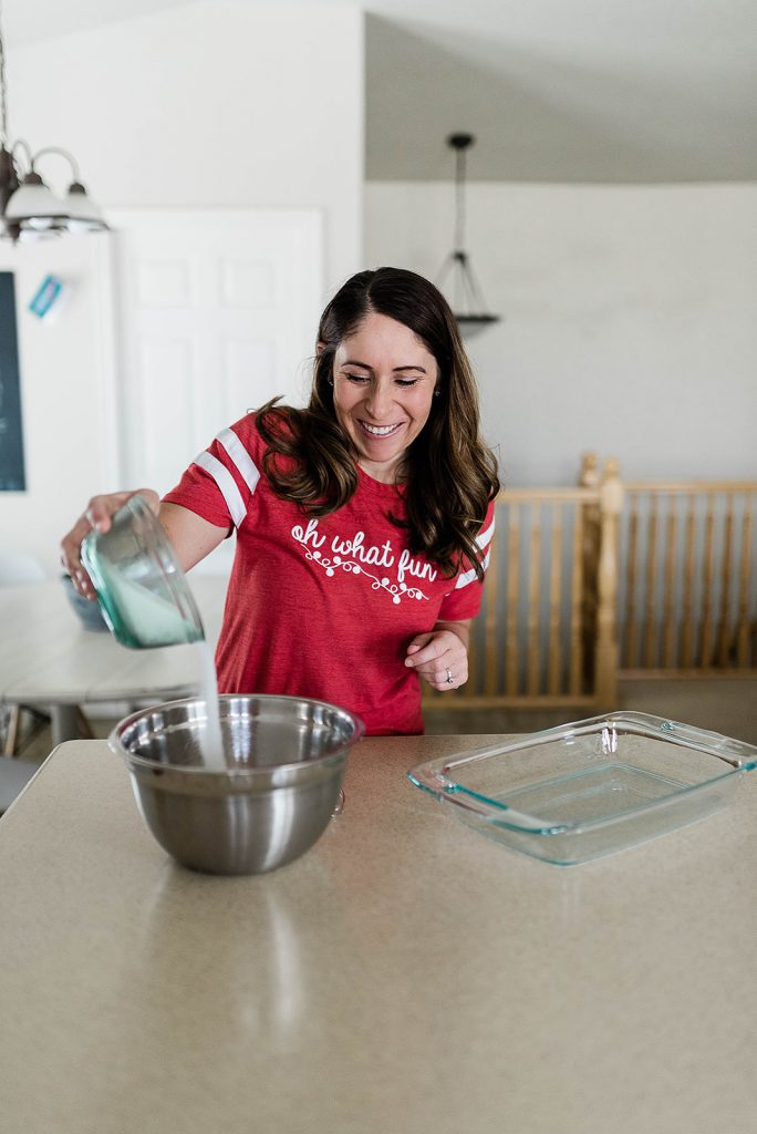 Andie is making the egg mixture in a large mixing bowl.