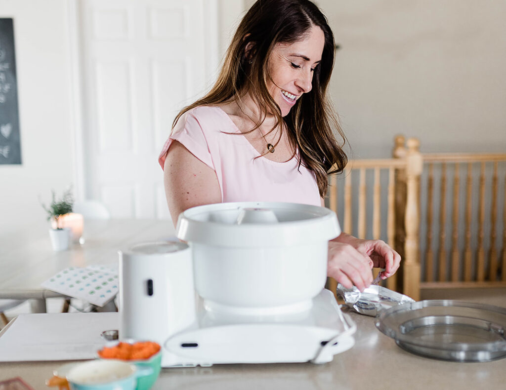 Photo of Andie adding the softened cream cheese to her mixer to make the carrot cake dip.