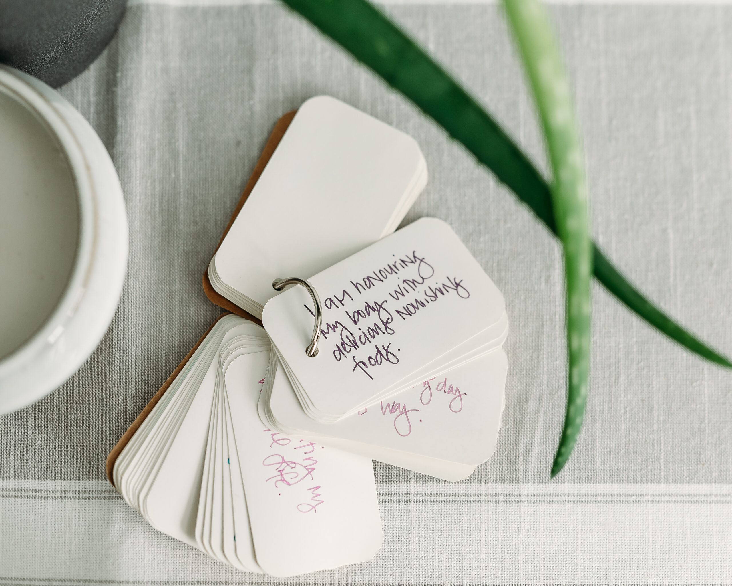 I am affirmations laid out on table showcasing a couple of examples. 