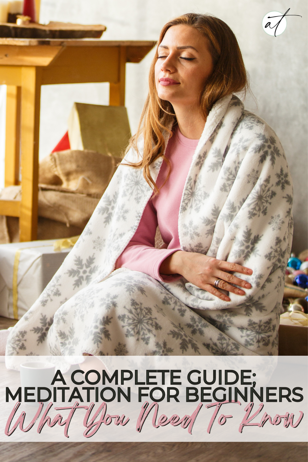 Photo of a woman curled up in a blanket, eyes closed sitting crossed legged. Meditation For Beginners 