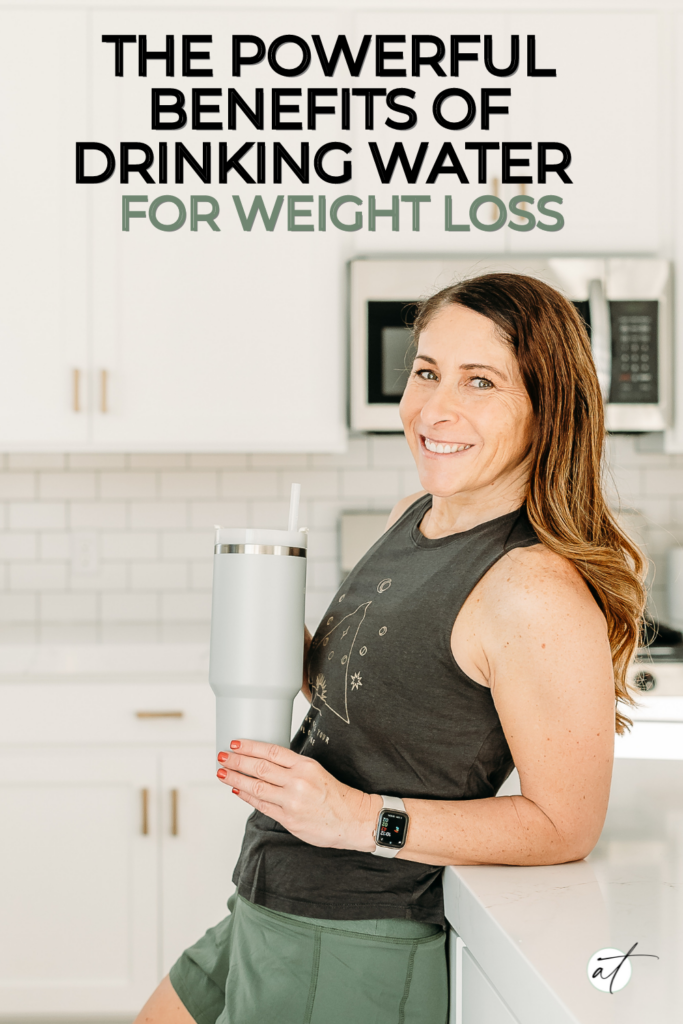 Andie drinking water after a workout. Clearly she understand the benefits of drinking water for weight loss.