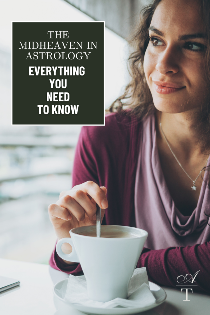 Photo of a woman dressed in maroon colors looking out contemplating while stirring her mug of coffee in a white mug, she is contemplating her Midheaven placement
